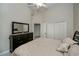 Neutral bedroom featuring a closet and dresser for ample storage space at 26089 Templar Ln, Punta Gorda, FL 33983
