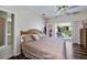 Bedroom opens to screened lanai with a pool at 26089 Templar Ln, Punta Gorda, FL 33983