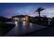 Well-maintained house featuring a paved driveway, manicured lawn and landscaped garden at 26089 Templar Ln, Punta Gorda, FL 33983