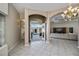 Spacious foyer with tiled floors and arched entryways leading to the living areas at 26089 Templar Ln, Punta Gorda, FL 33983