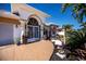 Inviting home showcasing manicured landscaping, elegant planters and stylish front door at 26089 Templar Ln, Punta Gorda, FL 33983