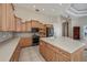 Bright kitchen featuring light wood cabinets and a large center island at 26089 Templar Ln, Punta Gorda, FL 33983
