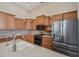 Well-equipped kitchen with light wood cabinets and stainless steel appliances at 26089 Templar Ln, Punta Gorda, FL 33983