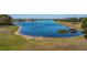 A tranquil lake view showcasing the waterfront property at 26089 Templar Ln, Punta Gorda, FL 33983