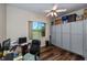 Office features a large window with a view, built in cabinets, and ceiling fan at 26089 Templar Ln, Punta Gorda, FL 33983