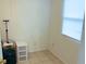 Small bedroom with a window and a built-in closet for storage at 3116 Crestwood Dr, Port Charlotte, FL 33952