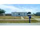 A charming single-story home featuring a well-maintained yard and a classic mailbox at the front of the property at 3116 Crestwood Dr, Port Charlotte, FL 33952