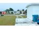 Home exterior with a clean and simple design complemented by lush lawn and a driveway at 3116 Crestwood Dr, Port Charlotte, FL 33952