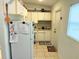 Efficient kitchen layout with ample cabinet space, durable tile flooring, and a tidy setup at 3116 Crestwood Dr, Port Charlotte, FL 33952