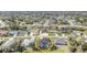 Aerial view of a residential neighborhood showcasing a home with a private backyard pool at 312 Mendoza St, Punta Gorda, FL 33983