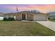 Charming single Gathering home with a well-manicured lawn and attached two car garage at 312 Mendoza St, Punta Gorda, FL 33983