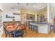 Spacious eat-in kitchen with wooden cabinetry, granite countertops, and recessed lighting at 312 Mendoza St, Punta Gorda, FL 33983