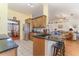 Open kitchen featuring granite countertops, a breakfast bar, and stainless steel appliances at 312 Mendoza St, Punta Gorda, FL 33983