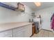 Convenient laundry room features counter space, storage cabinets, and modern washer and dryer at 312 Mendoza St, Punta Gorda, FL 33983