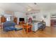 Bright and airy living room featuring vaulted ceilings and wood flooring at 312 Mendoza St, Punta Gorda, FL 33983