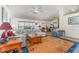 Bright open-concept living room with a large sectional sofa, a wooden coffee table and an inviting atmosphere at 312 Mendoza St, Punta Gorda, FL 33983