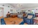 Inviting living room with a comfortable sectional sofa, a large rug, and bright natural lighting at 312 Mendoza St, Punta Gorda, FL 33983