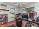 Dedicated office with a built-in bookshelf, a modern computer setup, and a comfortable chair at 312 Mendoza St, Punta Gorda, FL 33983