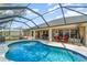 Inviting screened pool and patio area, great for relaxation and outdoor gatherings at 312 Mendoza St, Punta Gorda, FL 33983