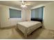 Bedroom featuring a window, ceiling fan, and carpeted floors at 3415 Harbor Blvd, Port Charlotte, FL 33952