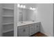 Modern bathroom with double vanity, sleek cabinets, and tile flooring at 368 Manly St, Port Charlotte, FL 33953