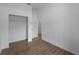 Bright bedroom featuring a closet, and modern wood-style tiled flooring, and bright lighting at 368 Manly St, Port Charlotte, FL 33953