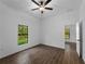 Comfortable bedroom with tile flooring and view of landscaped backyard at 368 Manly St, Port Charlotte, FL 33953