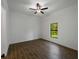 Bedroom with tile flooring and a window with a tranquil view of the backyard at 368 Manly St, Port Charlotte, FL 33953