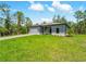 Attractive single-Gathering home with a driveway, garage, and a large front lawn under a sunny sky at 368 Manly St, Port Charlotte, FL 33953
