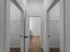 Hallway view to closets with tile floors and natural light at 368 Manly St, Port Charlotte, FL 33953