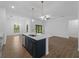 Kitchen island with pendant lighting overlooks the open living space and provides a stylish and functional focal point at 368 Manly St, Port Charlotte, FL 33953