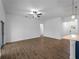 Open concept living area featuring tile floors and an island kitchen with modern appliances at 368 Manly St, Port Charlotte, FL 33953