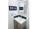 Bathroom featuring a vanity with a gray cabinet and a matching framed mirror at 4072 Oakview Dr # C5, Punta Gorda, FL 33980