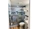 Modern walk-in shower featuring pebble flooring and glass door at 4072 Oakview Dr # C5, Punta Gorda, FL 33980