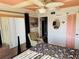 Cozy bedroom with a comfortable chair and a decorative ceiling fan at 4072 Oakview Dr # C5, Punta Gorda, FL 33980