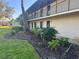 Side view of property with lush tropical landscaping at 4072 Oakview Dr # C5, Punta Gorda, FL 33980