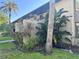 Exterior view of property with lush tropical landscaping and mature palm trees at 4072 Oakview Dr # C5, Punta Gorda, FL 33980