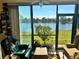 Bright living room boasting stunning lake views and comfortable seating arrangement at 4072 Oakview Dr # C5, Punta Gorda, FL 33980