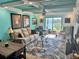 Bright living room with stylish rug, lake view, and comfortable seating at 4072 Oakview Dr # C5, Punta Gorda, FL 33980