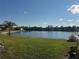Scenic pond view with tropical landscaping at 4072 Oakview Dr # C5, Punta Gorda, FL 33980