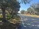 Quiet, tree-lined street with sidewalks and lush landscaping creating a peaceful atmosphere at 4072 Oakview Dr # C5, Punta Gorda, FL 33980