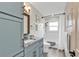 This bathroom includes a shower and bath, sleek countertops, and matching black fixtures at 4091 Rock Creek Dr, Port Charlotte, FL 33948