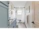 This bathroom includes a shower and bath, sleek countertops, and matching black fixtures at 4091 Rock Creek Dr, Port Charlotte, FL 33948