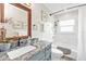 This updated bathroom features granite countertops, vanity, bath tub with a shower, and updated fixtures at 4091 Rock Creek Dr, Port Charlotte, FL 33948