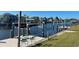 Waterfront boat lift provides convenient access to the canal with additional room to add chairs and enjoy the views at 4091 Rock Creek Dr, Port Charlotte, FL 33948
