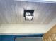 Covered front porch with wood ceiling and stylish lantern at 4091 Rock Creek Dr, Port Charlotte, FL 33948
