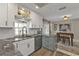 Bright kitchen featuring white cabinets, stainless steel appliances, and granite countertops at 4091 Rock Creek Dr, Port Charlotte, FL 33948