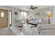 Bright living room with tile floors, neutral walls, and comfortable furnishings, including sofa and armchairs at 4091 Rock Creek Dr, Port Charlotte, FL 33948