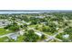 An aerial photograph of a serene neighborhood with tree-lined streets, and beautiful homes at 535 Milus St, Punta Gorda, FL 33950