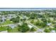 Lovely neighborhood featuring mature trees, well-maintained lawns and a glimpse of the water at 535 Milus St, Punta Gorda, FL 33950